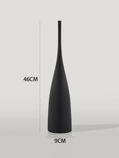Tall matte black bottle-shaped vase, 46 cm high and 9 cm wide at the base.