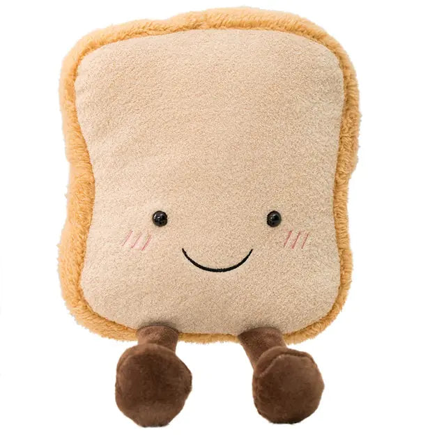 Smiling plush toy shaped like a slice of bread, with rosy cheeks and two small brown legs, on a white background.