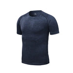 Men’s grey short-sleeve athletic T-shirt with a textured finish, crew neck, and black seam detailing.
