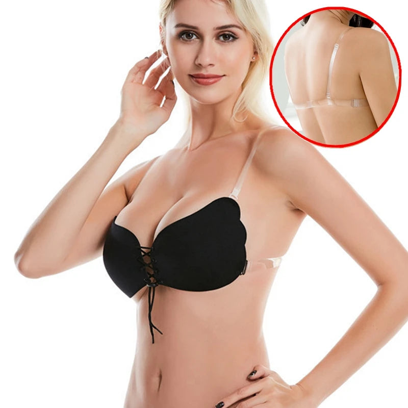 Woman modeling a black lace-up push-up bra with transparent shoulder straps and a clear back strap, with an inset image showing the back view.