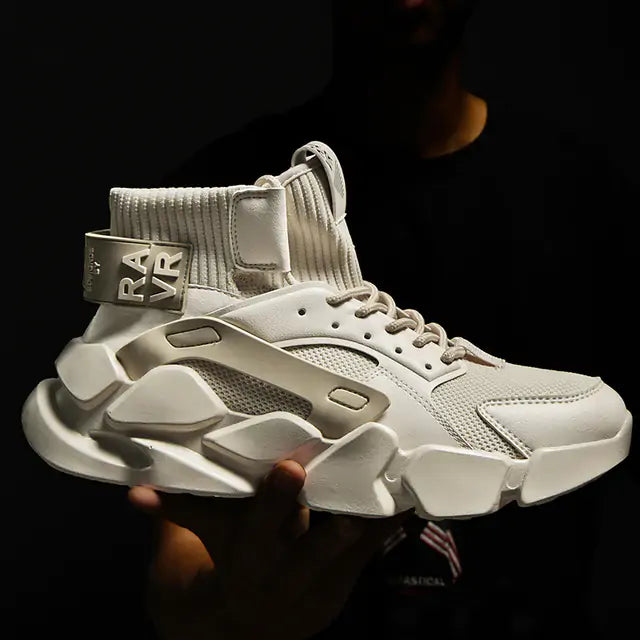 Chunky off-white high-top sneaker with a ribbed sock collar, lace-up front, and oversized sculpted sole.