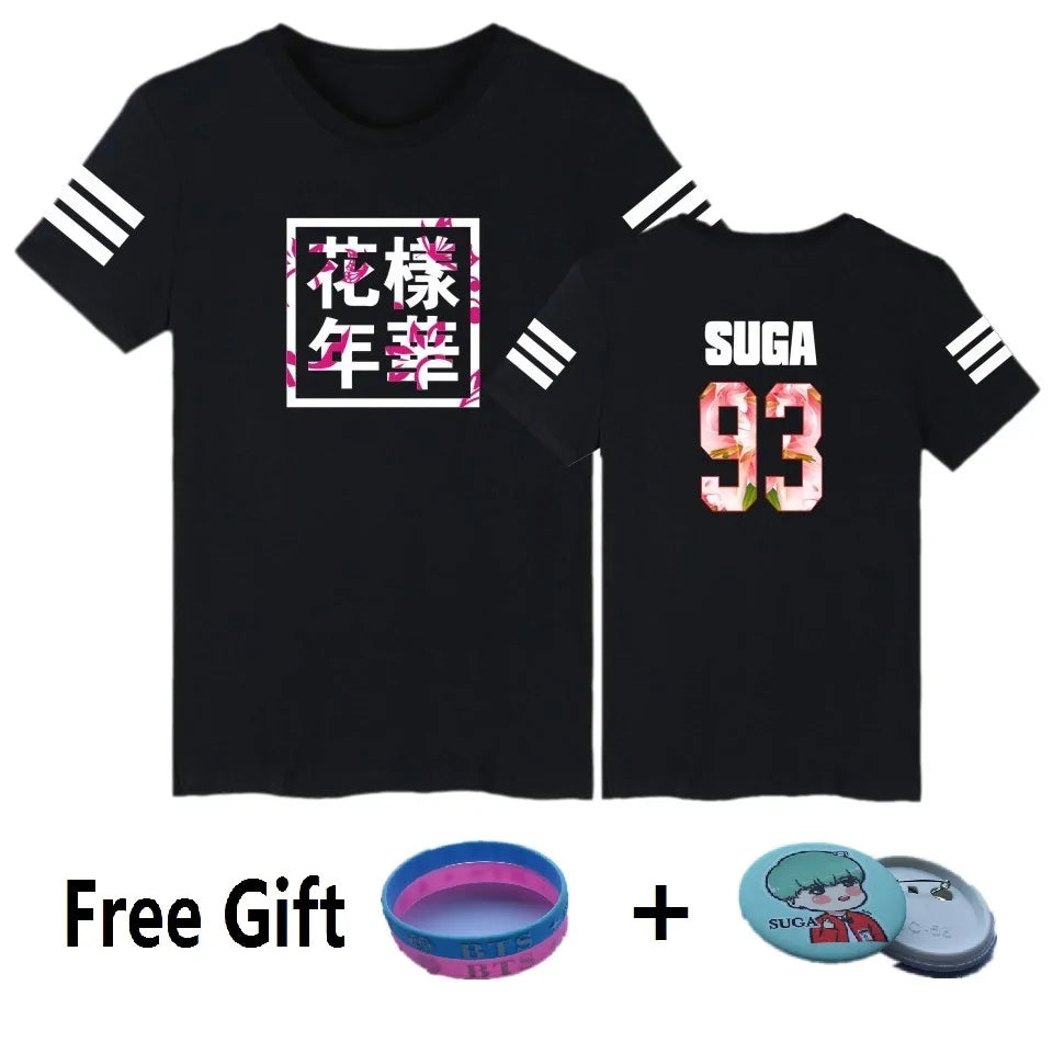 Black graphic T-shirt with printed front-and-back design and bonus BTS-themed accessories.