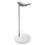 Minimalist metal stand with a circular base and a tall chrome pole topped by a small curved black cradle, shown on a white background.