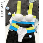 Flat-lay of a white color-block bikini set with wide neon yellow straps and bright blue bands, arranged on layered denim and dark fabric; “ELLOLACE” text appears along the left edge with small blue-and-white decorative balls nearby.