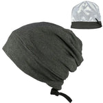 A set of two hats: one is a loose-fitting gray beanie with an adjustable strap, and the other is a small, shiny silver satin bonnet, likely used for protecting hair or as a sleeping cap.