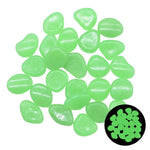 Pile of translucent lime-green glow stones on a white background, with a small inset showing the stones glowing green in the dark.