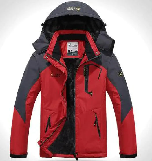 A green and gray outdoor jacket with a hood, multiple zippered pockets, and a logo on the chest and sleeve. The jacket appears to be designed for cold or wet weather, with a waterproof or windproof material.