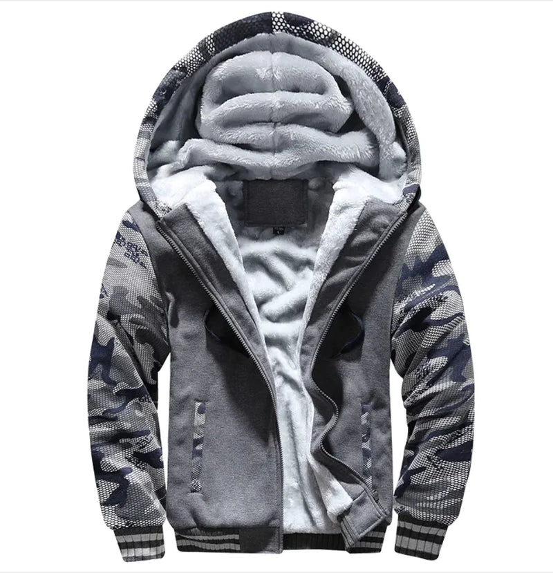 A stylish two-tone hoodie with a navy blue body and red sleeves, featuring a thick, plush gray fleece lining for warmth. The hood is large and lined with the same soft material, and the jacket includes a full-length zipper and two front pockets with red accents. Designed for cold weather comfort.