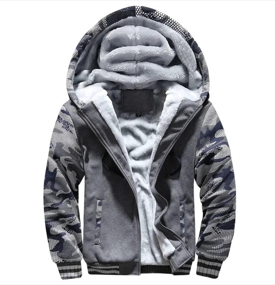 A stylish two-tone hoodie with a navy blue body and red sleeves, featuring a thick, plush gray fleece lining for warmth. The hood is large and lined with the same soft material, and the jacket includes a full-length zipper and two front pockets with red accents. Designed for cold weather comfort.