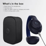 Graphic titled “What’s in the box” listing Beats Studio Pro headphones, a carrying case, a USB-C to USB-C cable, and a 3.5 mm audio cable, with images of the black case and dark Beats headphones.