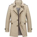 Beige trench-style coat with a wide lapel collar, button front, shoulder epaulets, cuff straps, and a zippered chest pocket, shown on a white background with a checkered lining visible inside.
