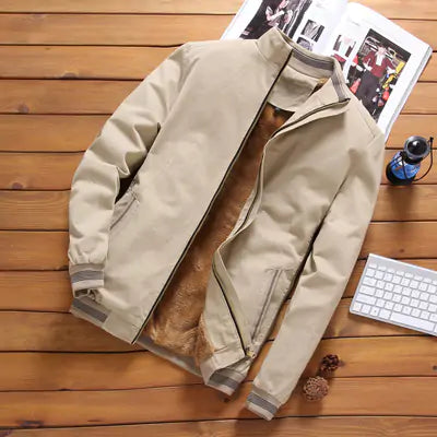 Beige hooded poncho-style pullover jacket with front pocket.
