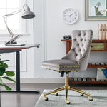 Gray office chair with gold accents in a home office setting