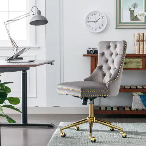 Gray office chair with gold accents in a home office setting