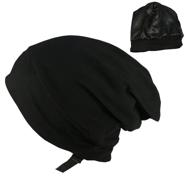 A black satin bonnet/sleep cap shown on a white background, with a small inset image in the top-right showing the same bonnet from another angle.