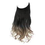 Long wavy hair extension with a black-to-ash-blonde ombré and curled ends, shown on a white background.