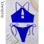 Royal blue two-piece bikini set laid flat on a light marble background, featuring a strappy halter-style top and tie-side bottoms.