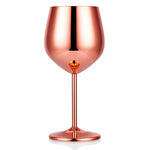 Rose gold wine glass on a white background