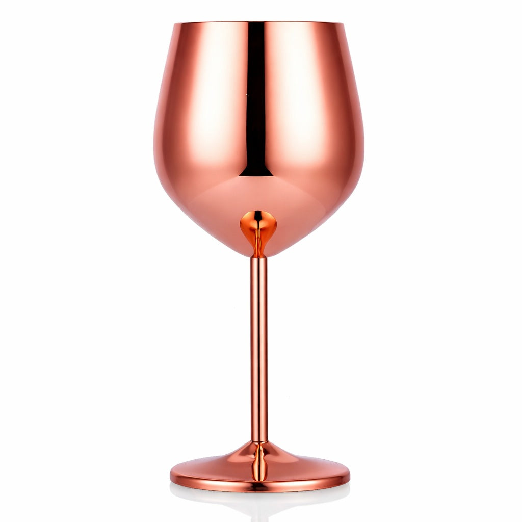 Rose gold wine glass on a white background