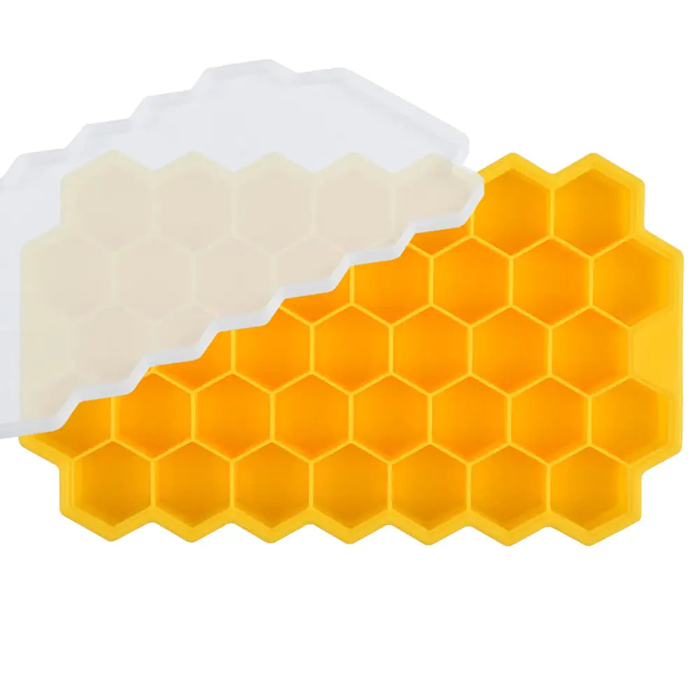 Green silicone ice cube tray with a honeycomb pattern of hexagonal compartments, shown on a white background.
