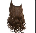 Long, wavy hair extensions transitioning from brown at the roots to golden at the tips, labeled “Brown to Golden.