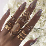 woman's fingers with lots of rings