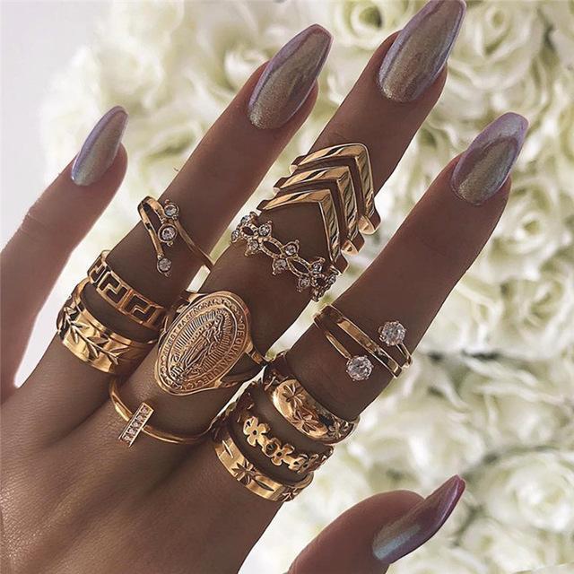 woman's fingers with lots of rings