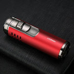 A close-up product photo of a compact red rechargeable lighter (or torch-style igniter) lying on a dark textured fabric surface. It has metallic silver ends and a silver top section with a sliding ignition switch, plus small ventilation slots on the side. The brand name “HONEST” is printed in white on the red body.