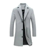 A stylish light gray men's overcoat with a slim-fit design, featuring a three-button front closure and a notched lapel. The coat is made from a smooth fabric with a slightly structured silhouette and has a black inner lining visible from the slightly open front. The long sleeves and mid-thigh length add to its formal and sophisticated look.