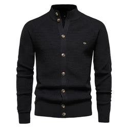 A sophisticated knitted cardigan with a mandarin collar and a button-up front. The cardigan features a textured pattern, ribbed cuffs and hem, and brown-toned buttons that add a stylish contrast. A small embroidered logo is visible on the left chest, enhancing its elegant design