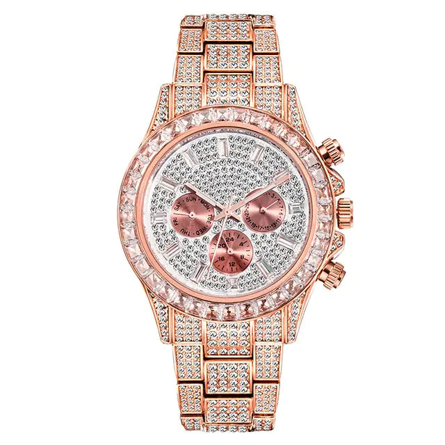 Rose-gold tone wristwatch covered in rhinestones, with a crystal-studded bezel, three subdials on a glittery silver face, and a matching pavé link bracelet, shown on a white background.