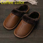 A pair of cozy brown indoor slippers with dark brown faux fur lining, displayed on a dark wooden floor.