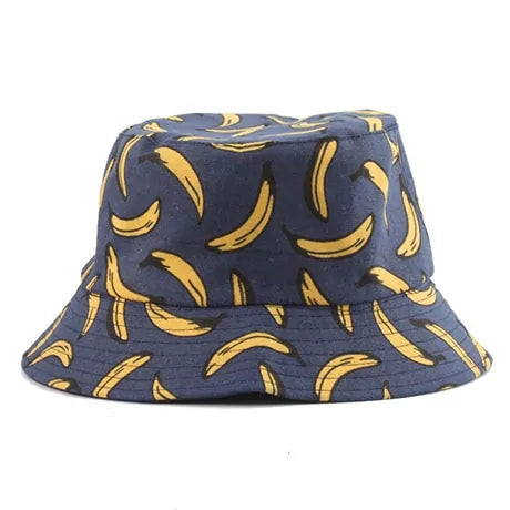 Navy blue bucket hat with an all-over yellow banana print on a white background.