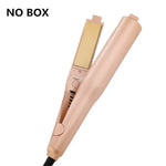 Rose-gold hair straightener (flat iron) shown open with a control panel and power cord, on a white background; text in the top-left reads “NO BOX.