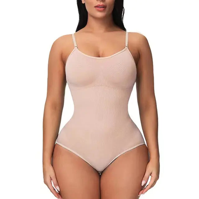 Front view of a model wearing a nude-colored seamless shapewear bodysuit with thin adjustable straps and high-cut leg openings on a white background.