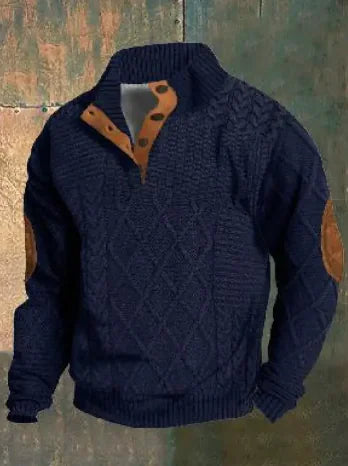 A dark brown men's pullover sweater with a textured cable knit pattern on the front. The sweater features a high ribbed collar with tan brown buttoned detailing, ribbed cuffs and hem, and matching tan elbow patches. The background consists of distressed, multicolored metal panels.