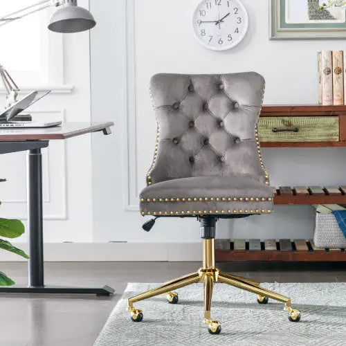 Gray office chair with gold accents in a home office setting