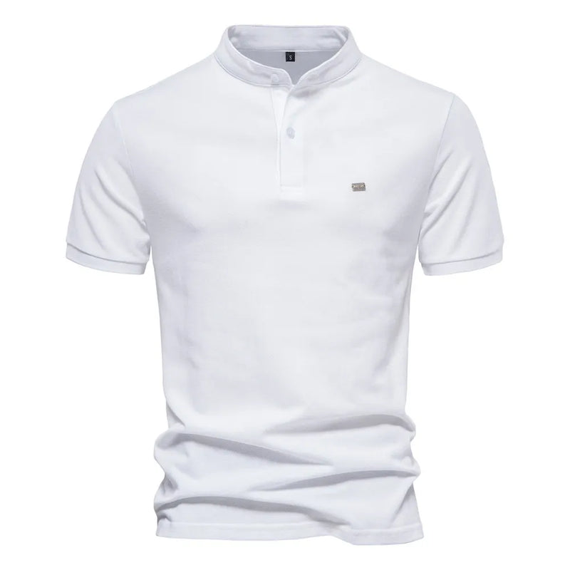 A beige short-sleeved polo shirt with a mandarin collar and a two-button placket. The fabric appears soft, and there is a small embroidered logo on the left chest. The shirt has a modern, slim fit with neatly stitched hems.