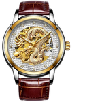 Two-tone wristwatch with a brown leather strap, gold bezel and crown, and a textured silver dial featuring a gold dragon skeleton design and crystal hour markers.