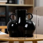 Glossy black vase with twin loop handles and size measurements shown.