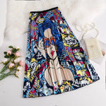 Pleated midi skirt with a gradient design, transitioning from dark black at the waistband to a soft blush pink at the hem, hanging on a black clothing rack next to a vintage-style camera.