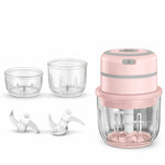 Pink handheld blender with clear containers and attachments on a white background