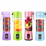 Four colorful portable blenders with fruit patterns on a white background