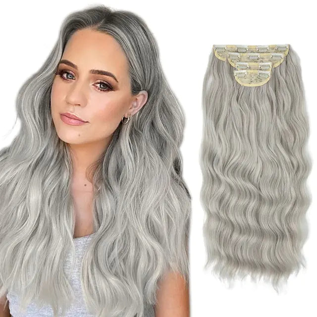 Side-by-side image of a woman with long, wavy silver-gray hair and a matching set of clip-in wavy hair extensions shown from the back with beige clips on a white background.