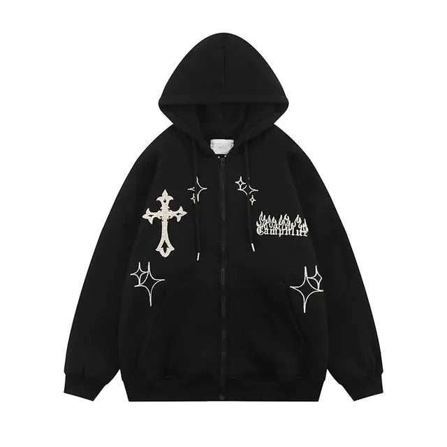 A black zip-up hoodie with white graphic prints, including a cross, sparkles, and a small flame-style text design on the chest, shown on a white background.