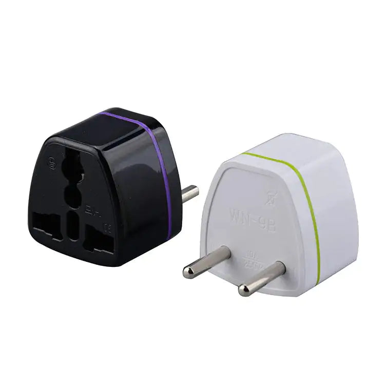 Two compact plug travel adapters, one black and one white, with multi-standard socket input and two-pin European plug design.