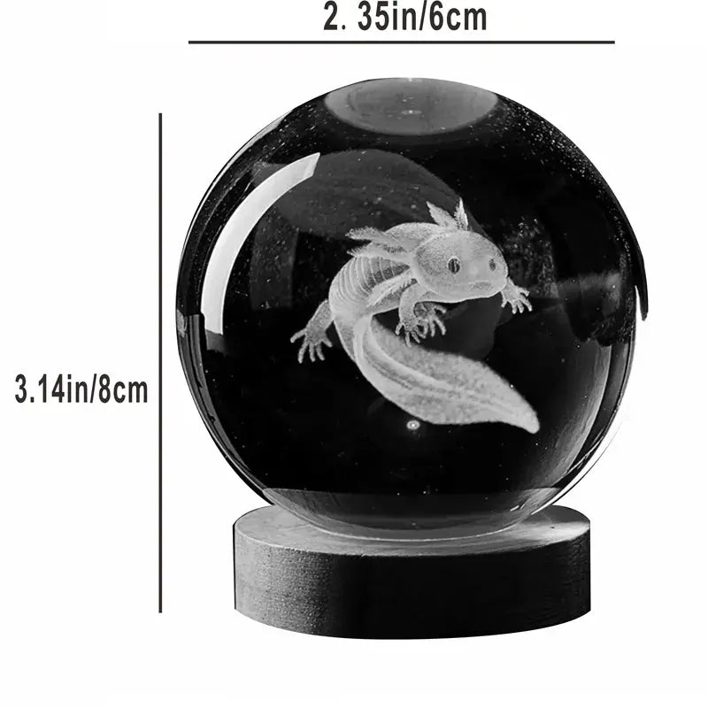 Black glass crystal ball with a 3D etched salamander/axolotl inside, displayed on a round base, with size labels showing about 2.35 in (6 cm) wide and 3.14 in (8 cm) tall.