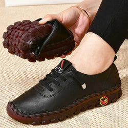 A man wearing ne leg of sneakers while holding one leg 