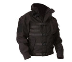 Black tactical jacket with a high collar, front zip closure, multiple buckle straps across the chest, and patch panels on the sleeves, shown on a white background.