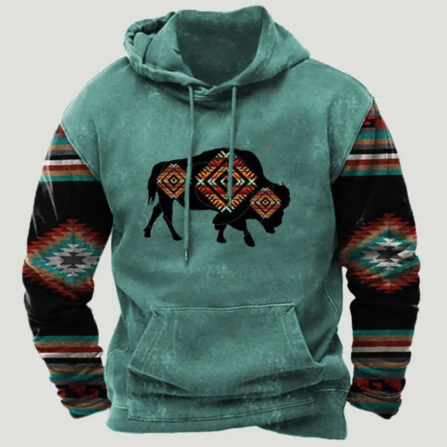 Teal hooded sweatshirt with a kangaroo pocket, featuring a black buffalo graphic with geometric tribal-style patterns and multicolour patterned sleeves.
